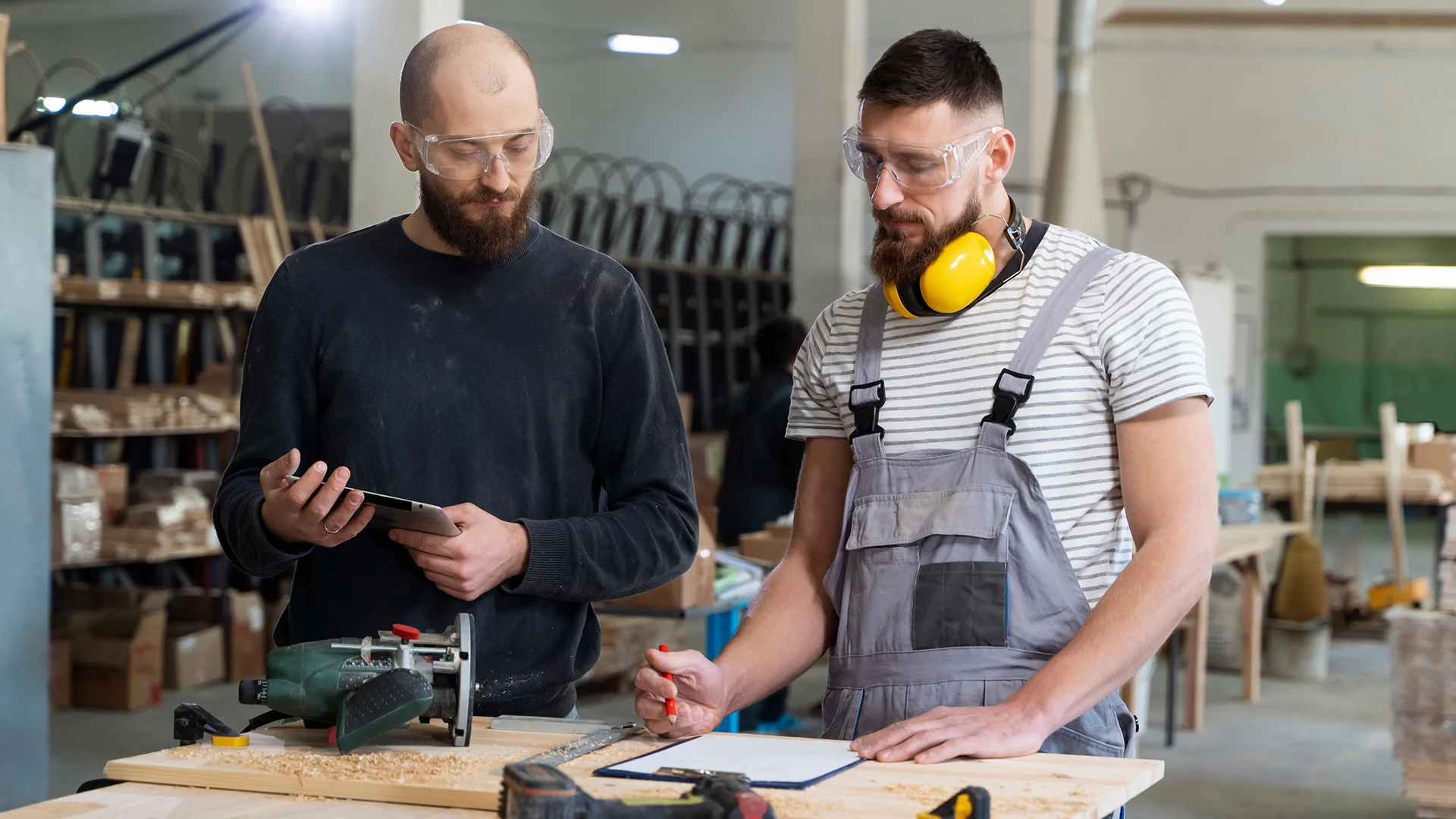 Men working on cutting mdf board